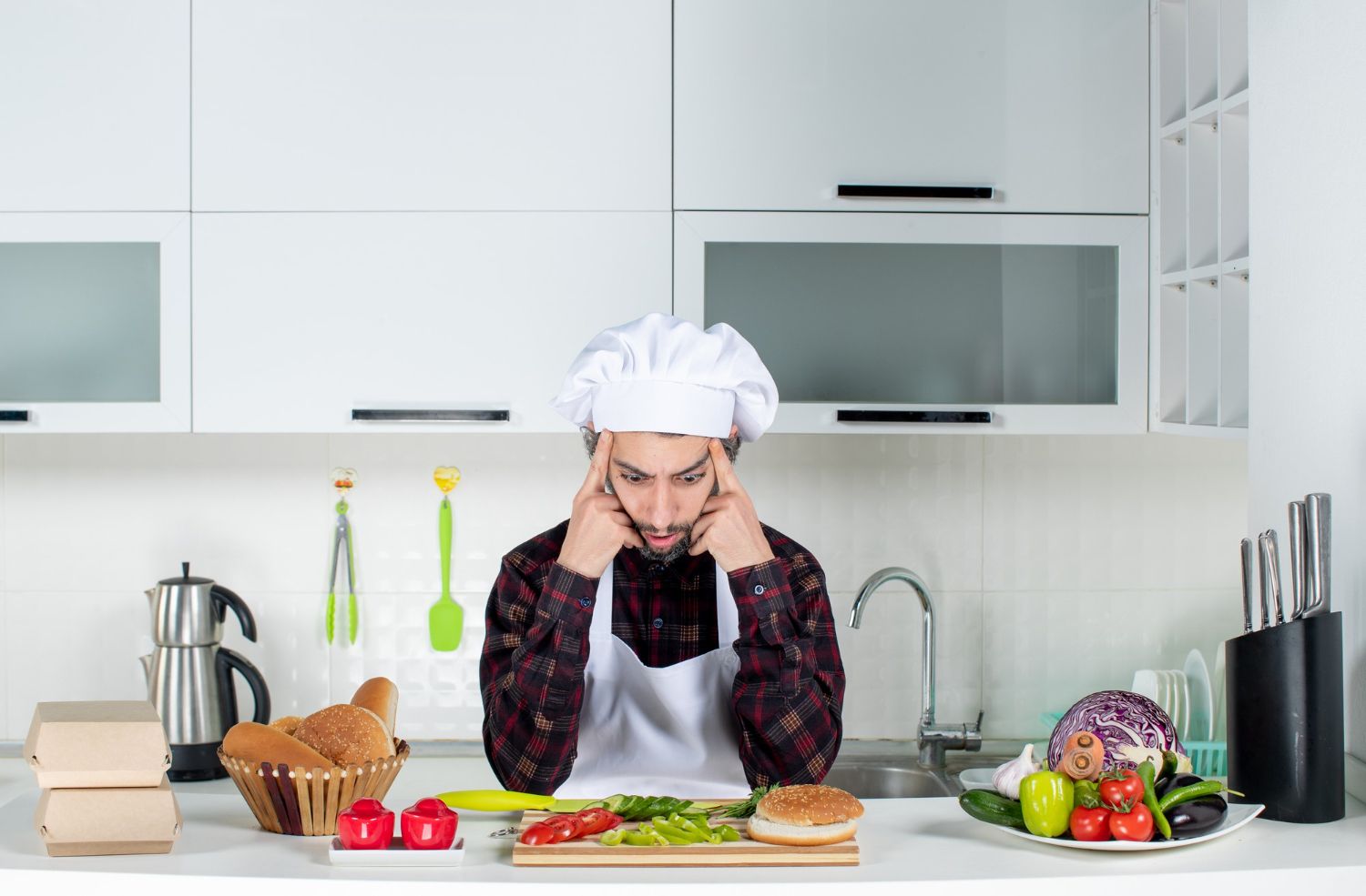 front view confused male chef thinking about something in the kitchen (1)